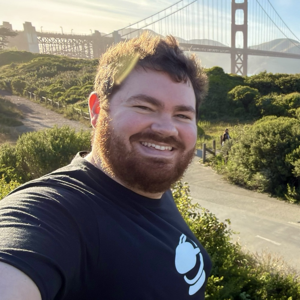 Zachary Fletcher, smiling, with the Golden Gate Bridge in the background